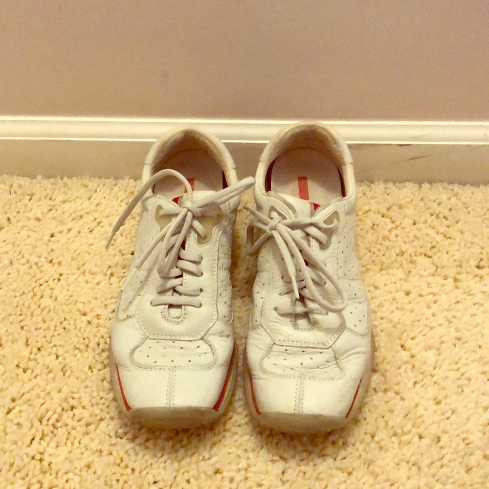 Prada white sneakers with red trim